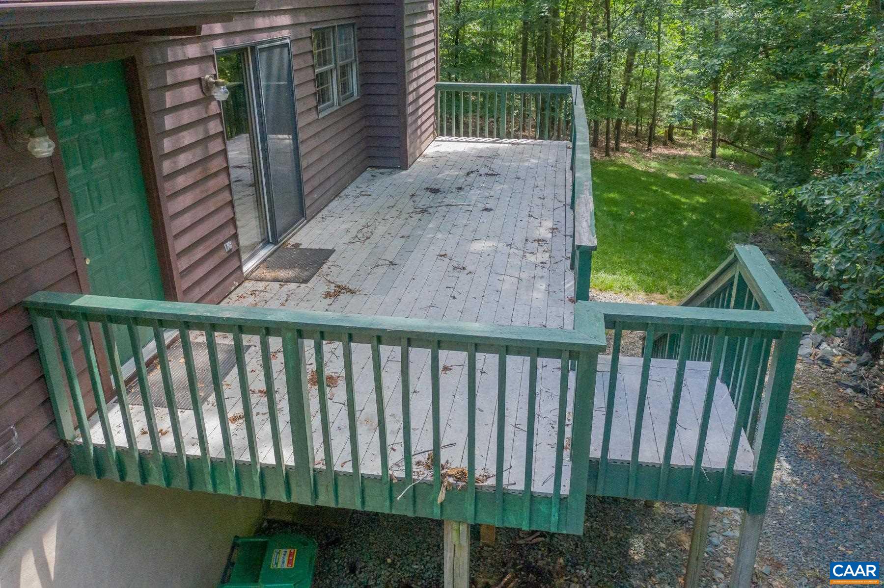 21 Briarwood Road Palmyra, VA 22963 - Photo 34 of 37 a view of a backyard with a small deck and a garden
