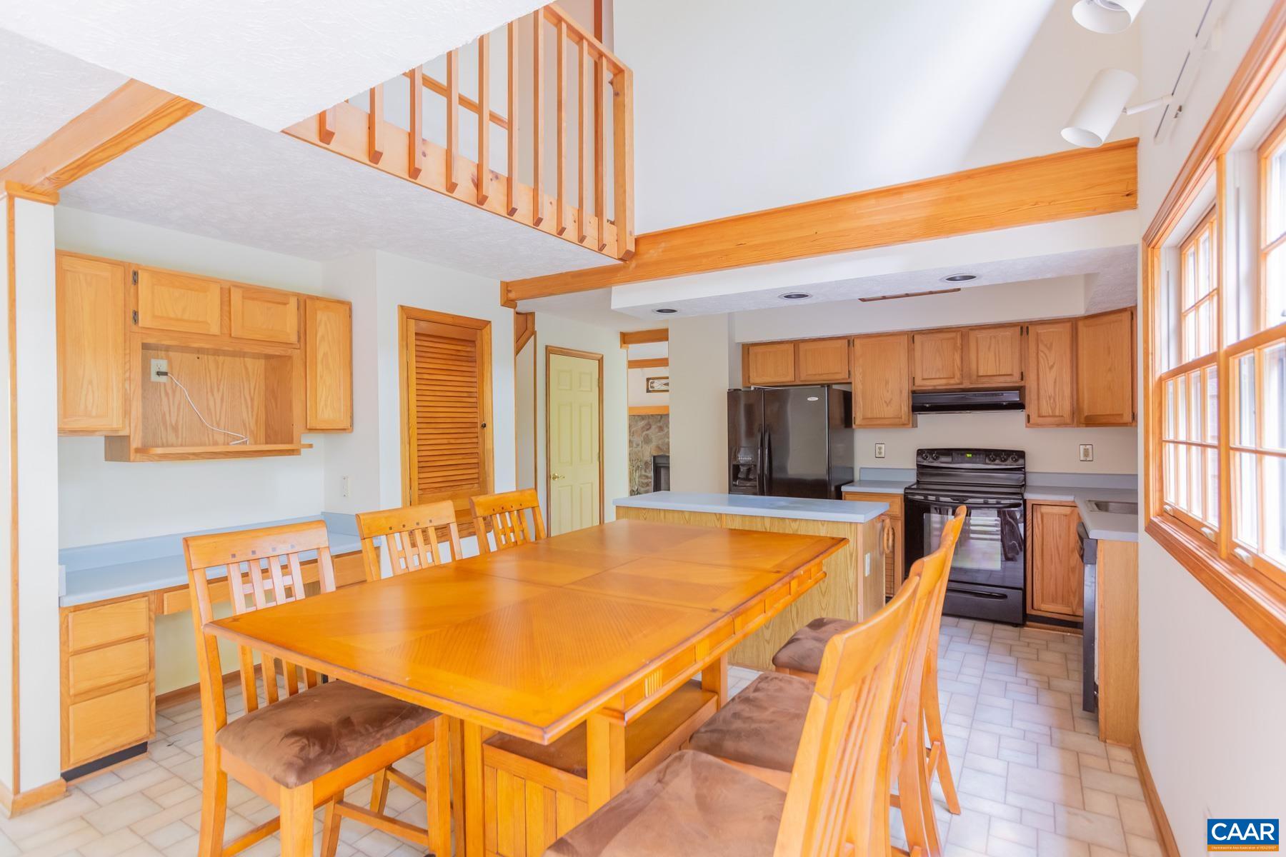 21 Briarwood Road Palmyra, VA 22963 - Photo 7 of 37 a dining room with furniture and a kitchen view
