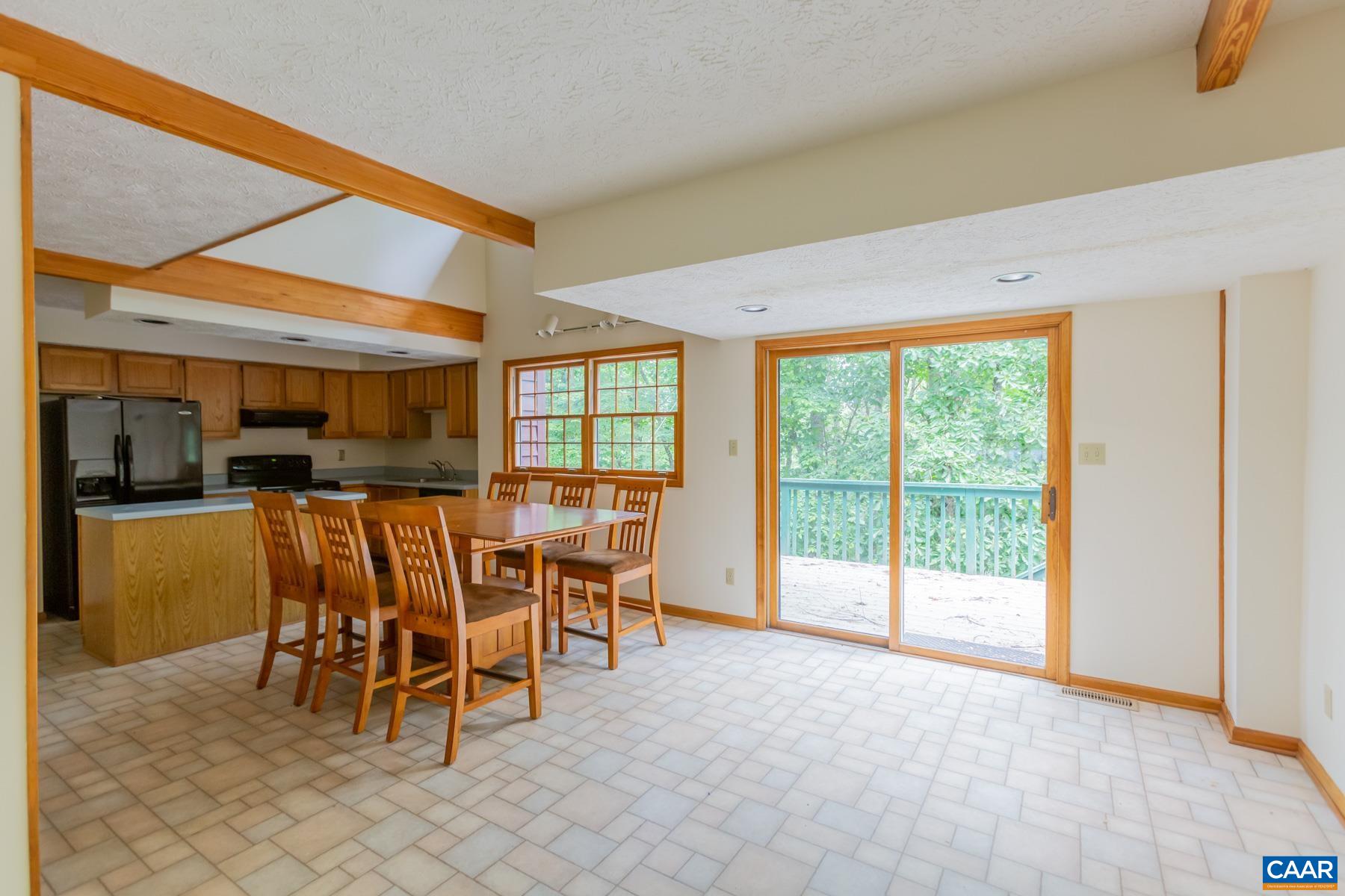 21 Briarwood Road Palmyra, VA 22963 - Photo 10 of 37 a dining room with furniture and a floor to ceiling window