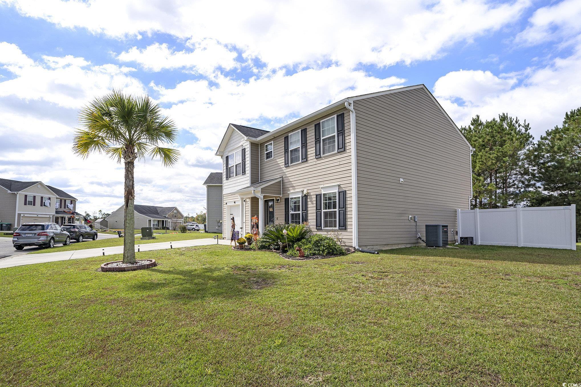 763 Trap Shooter Circle Longs, SC 29568 - Photo 2 of 37 View of property exterior featuring a central air condition unit and a residential view