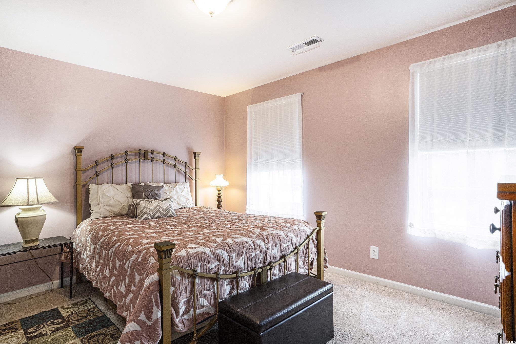 763 Trap Shooter Circle Longs, SC 29568 - Photo 23 of 37 Bedroom with light colored carpet and baseboards