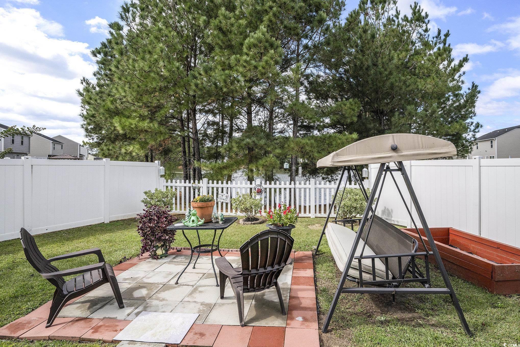 763 Trap Shooter Circle Longs, SC 29568 - Photo 28 of 37 Fenced backyard featuring a patio area