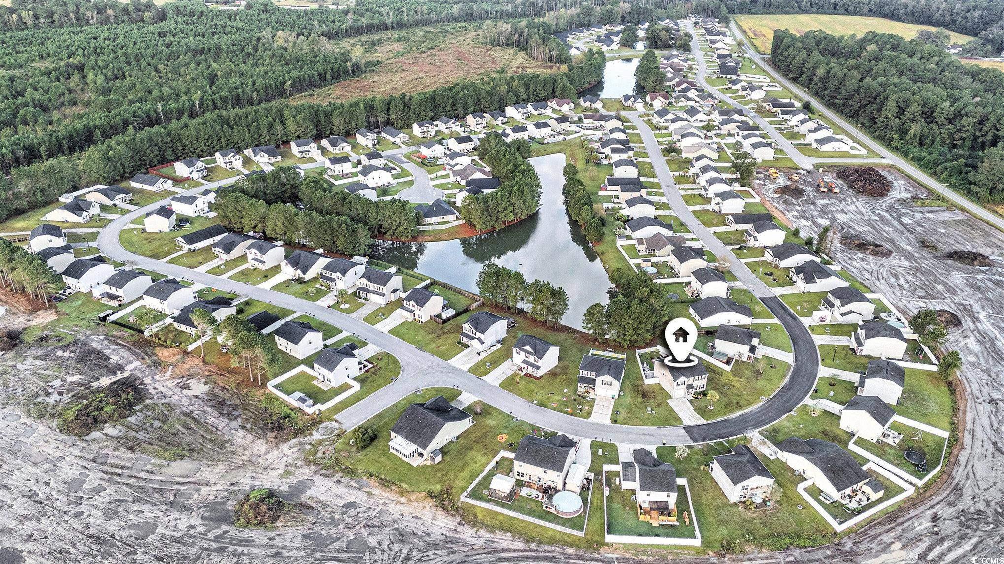 763 Trap Shooter Circle Longs, SC 29568 - Photo 36 of 37 Aerial view of property and surrounding area with nearby suburban area and a nearby body of water