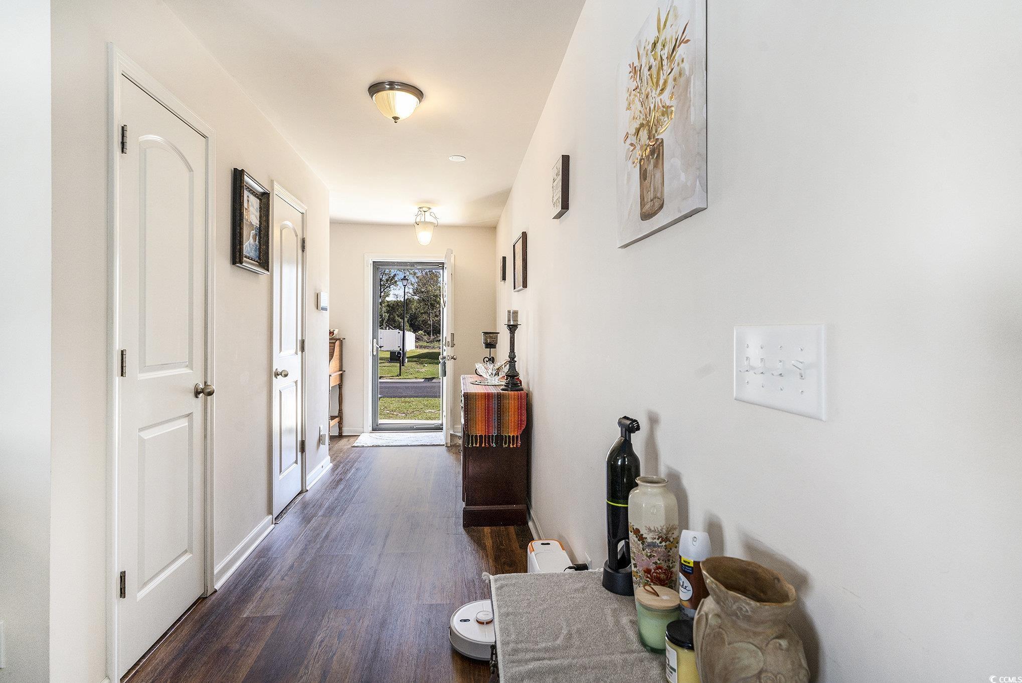 763 Trap Shooter Circle Longs, SC 29568 - Photo 6 of 37 Hallway with dark wood finished floors and baseboards