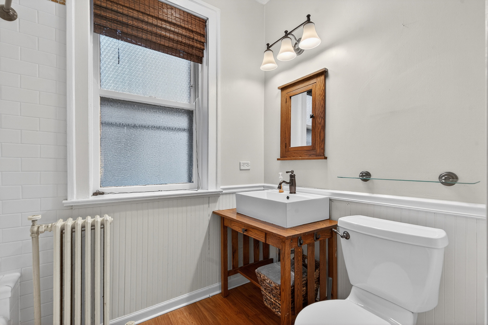 344 Wisconsin Avenue, Unit 1 Oak Park, IL 60302 - Photo 12 of 20 a bathroom with a toilet a sink and mirror