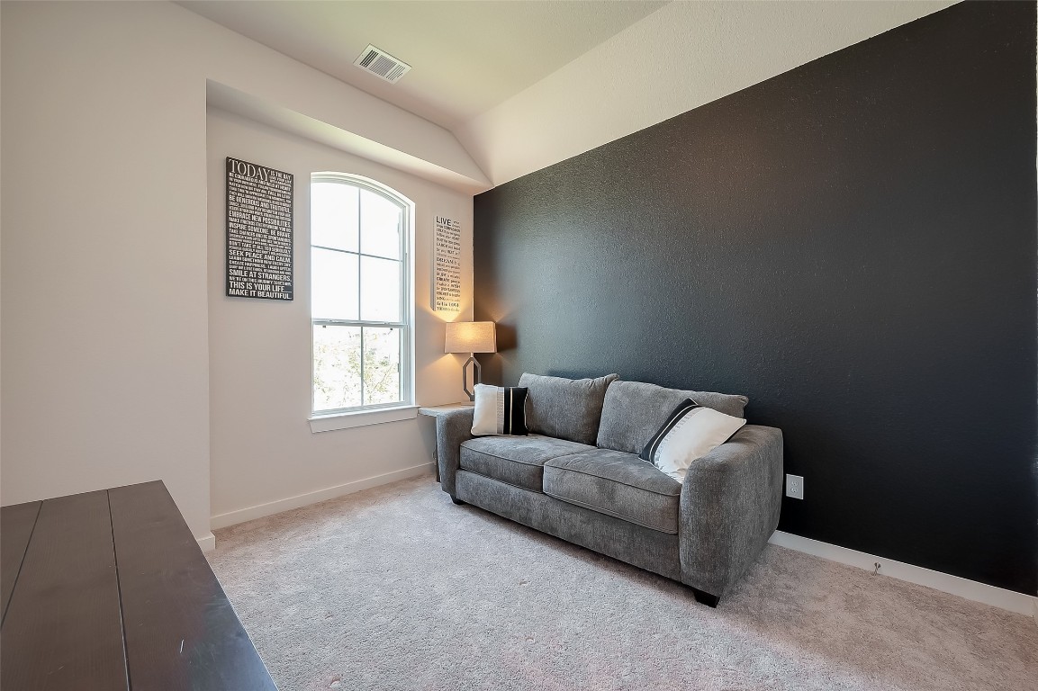 15714 Autumn Sun Conroe, TX 77302 - Photo 11 of 31 a living room with furniture and a window