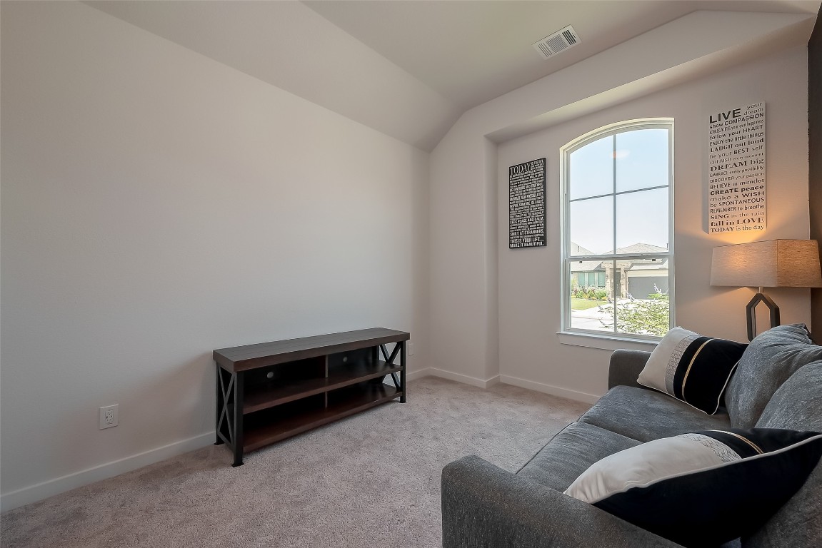 15714 Autumn Sun Conroe, TX 77302 - Photo 12 of 31 a living room with furniture and a window
