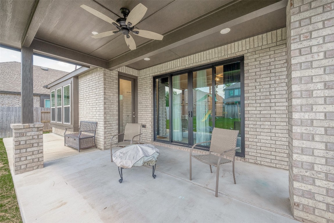 15714 Autumn Sun Conroe, TX 77302 - Photo 29 of 31 a living room with furniture and a large window