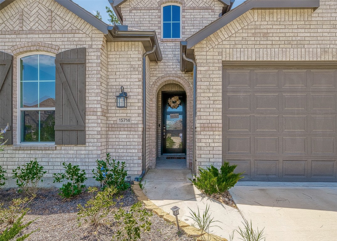 15714 Autumn Sun Conroe, TX 77302 - Photo 6 of 31 a front view of a house with potted plants