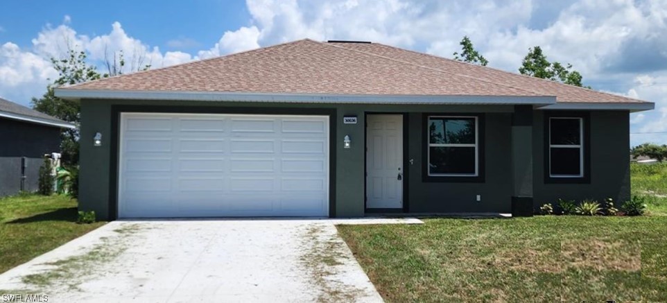 30036 Red Pine Road Punta Gorda, FL 33982 - Photo 3 of 12 a front view of a house