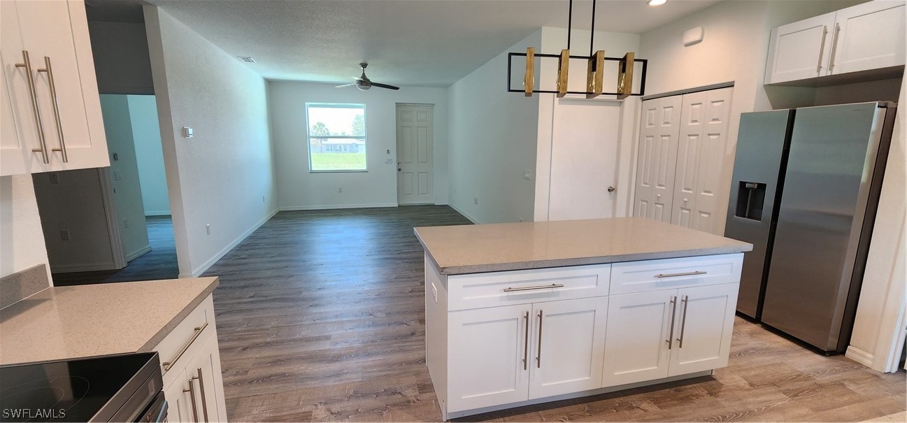 30036 Red Pine Road Punta Gorda, FL 33982 - Photo 6 of 12 a kitchen with a refrigerator and countertop