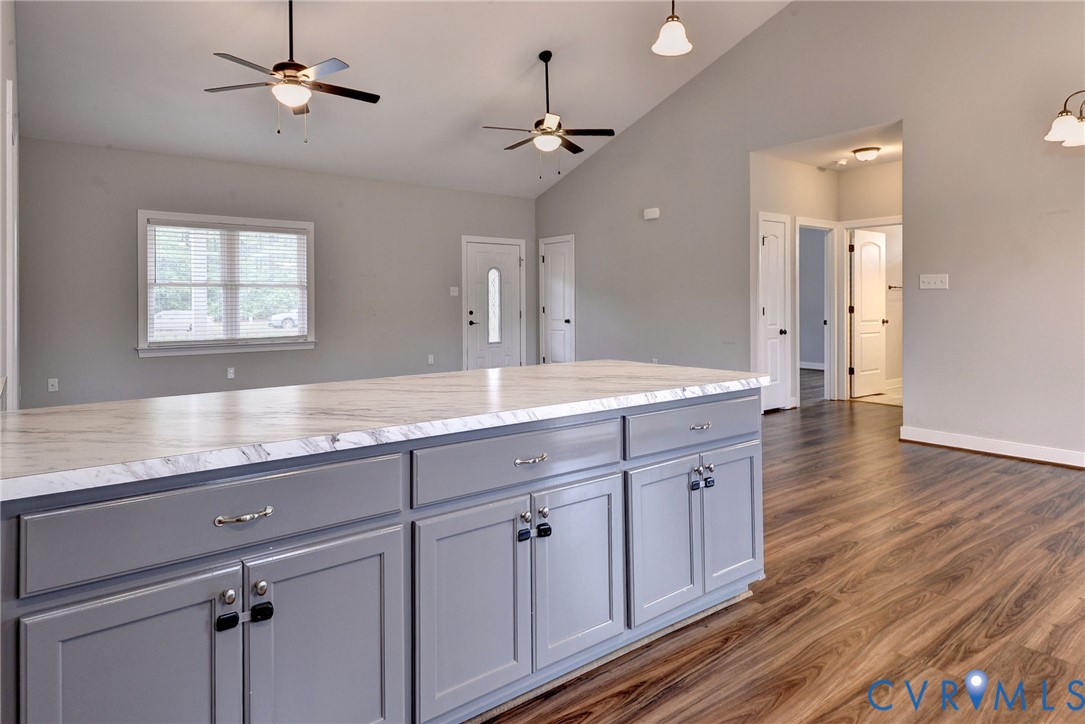 8904 Rock Cedar Road New Kent, VA 23124 - Photo 14 of 37 a spacious bathroom with a granite countertop sink a mirror and shower
