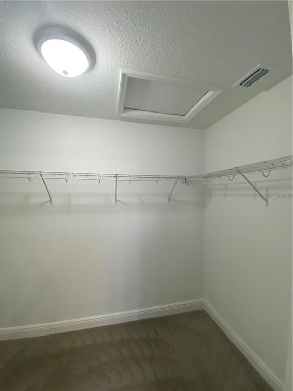 3200 Southwest 129th Loop Ocala, FL 34473 - Photo 16 of 29 a view of a room with racks on the wall