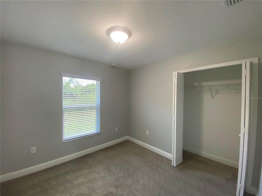 3200 Southwest 129th Loop Ocala, FL 34473 - Photo 18 of 29 an empty room with a window