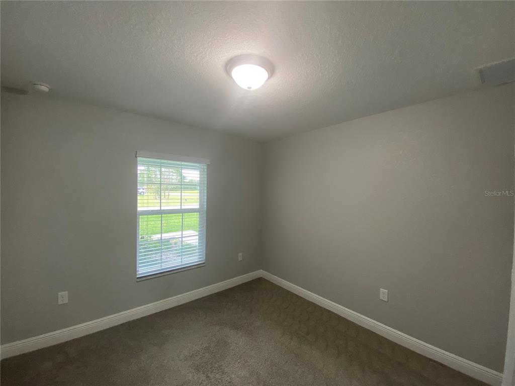 3200 Southwest 129th Loop Ocala, FL 34473 - Photo 20 of 29 an empty room with a window