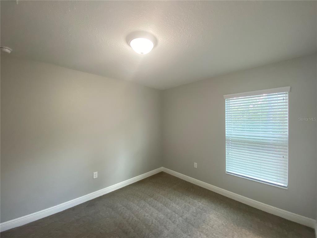 3200 Southwest 129th Loop Ocala, FL 34473 - Photo 23 of 29 an empty room with a window