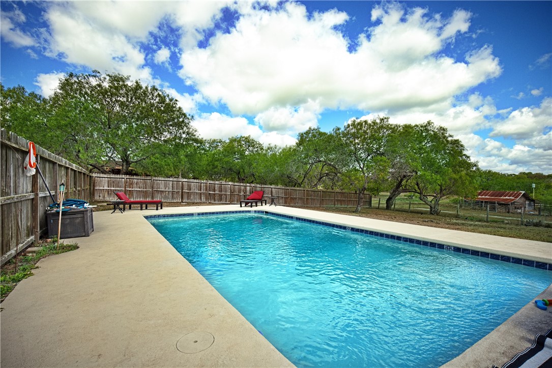 234 East Trant Road Kingsville, TX 78363 - Photo 28 of 32 a view of a swimming pool with a lake view