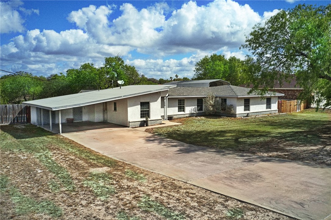 234 East Trant Road Kingsville, TX 78363 - Photo 3 of 32 a front view of a house with a garden