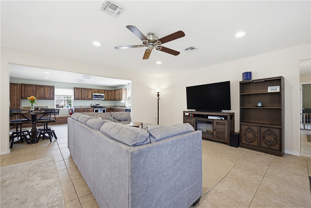 234 East Trant Road Kingsville, TX 78363 - Photo 7 of 32 a living room with furniture and a flat screen tv