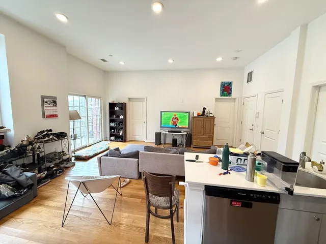 a work room with furniture and wooden floor