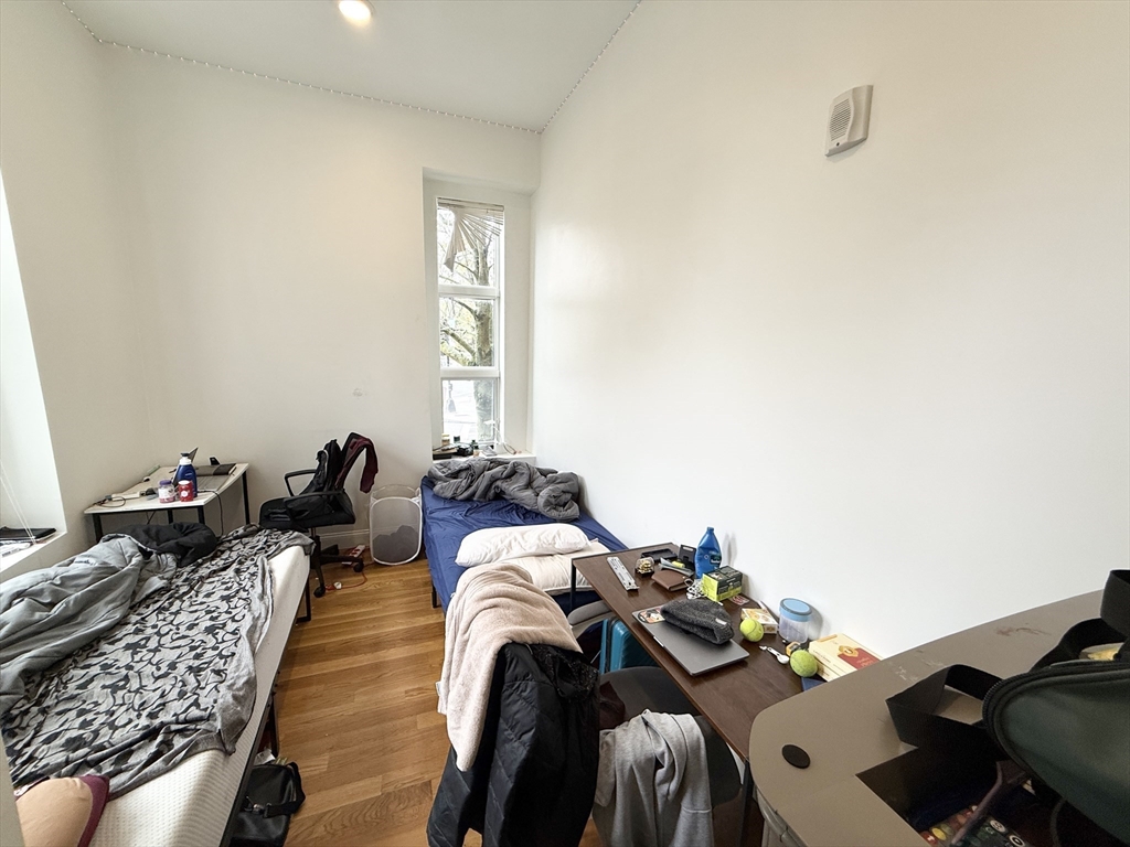 409 Dudley Street, Unit 2 Boston, MA 02119 - Photo 7 of 8 a bed room with two beds and a window