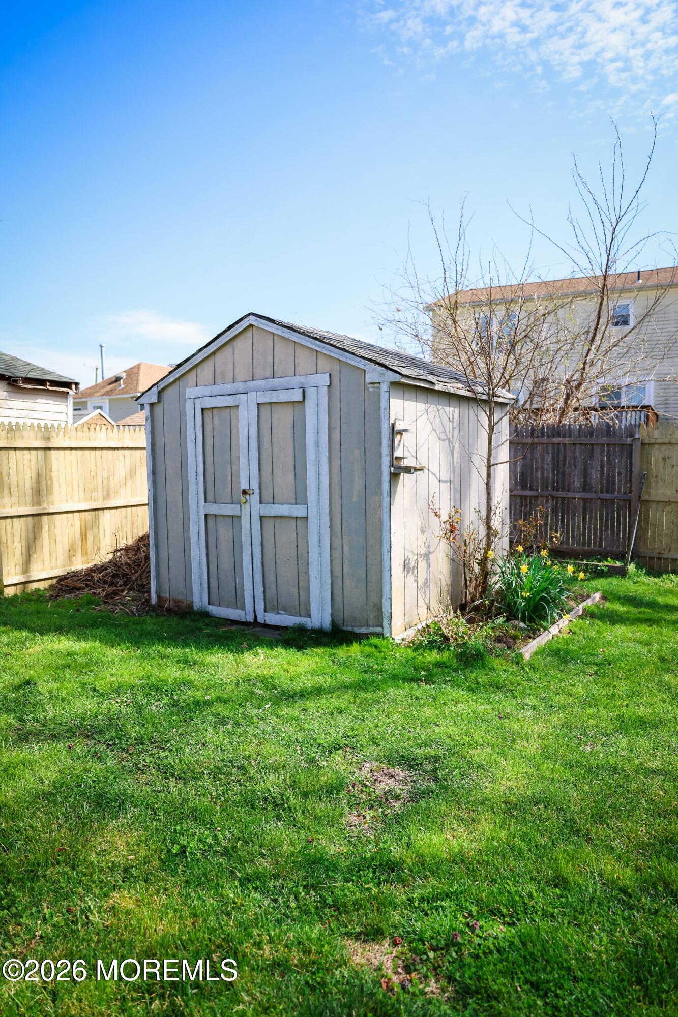 320 Lorillard Avenue Union Beach, NJ 07735 - Photo 23 of 24 a view of a backyard with potted plants and large tree