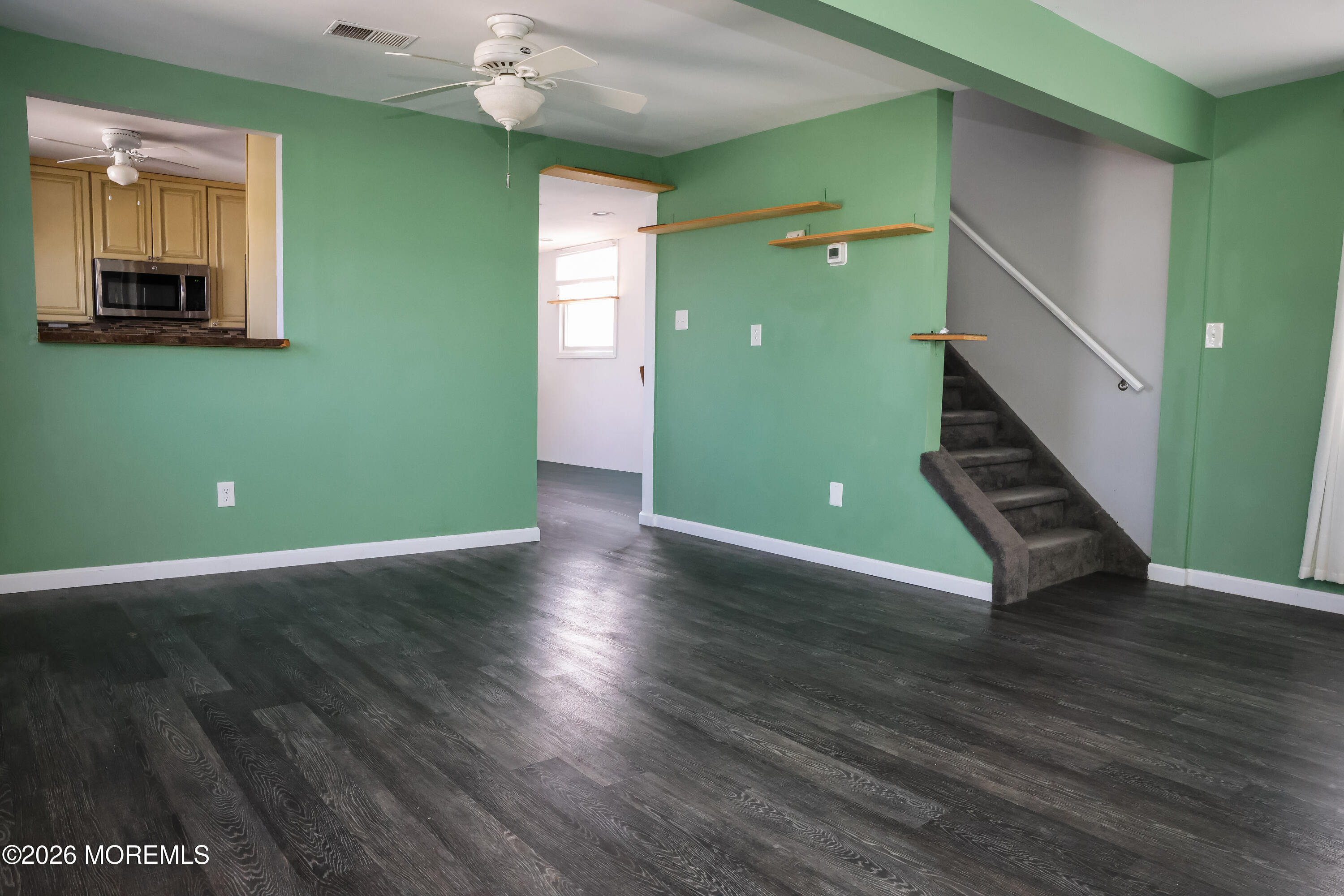 320 Lorillard Avenue Union Beach, NJ 07735 - Photo 3 of 24 an empty room with wooden floor and entryway
