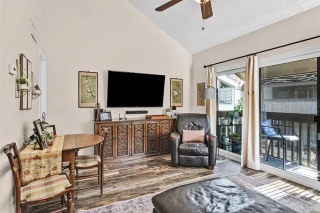 a bedroom with furniture and a flat screen tv