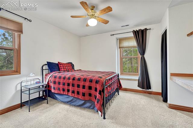 10745 Hungate Road Colorado Springs, CO 80908 - Photo 26 of 46 Second of three additional upstairs bedrooms with window seat...