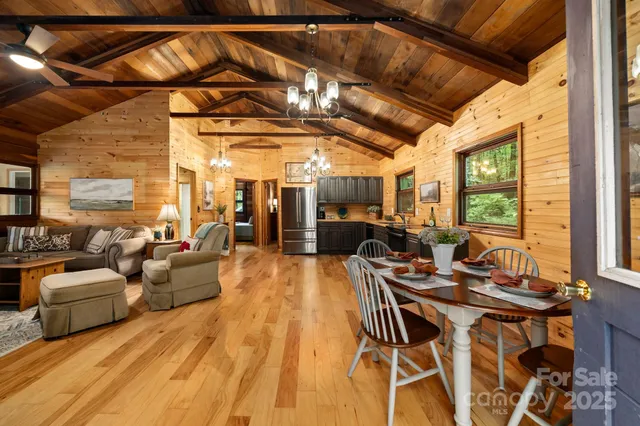 a view of a livingroom with furniture and a large window