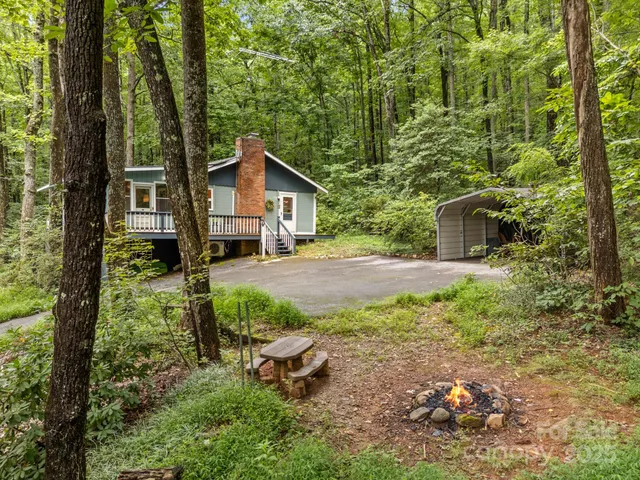a house view with a backyard space