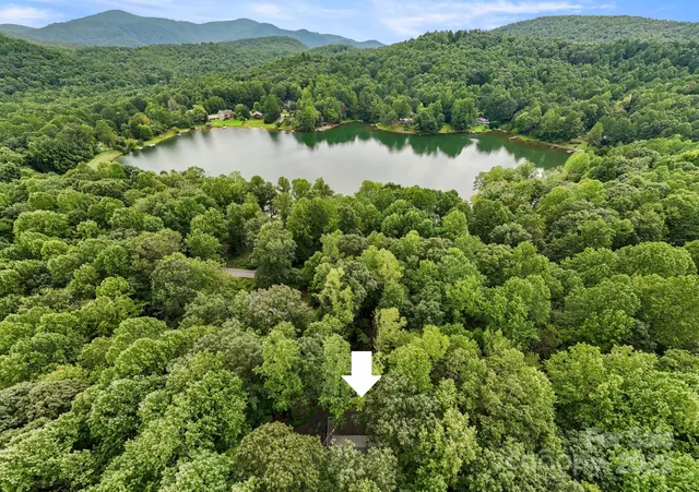 a view of a lake with a house in the background