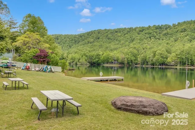 a view of a lake with a house in the background