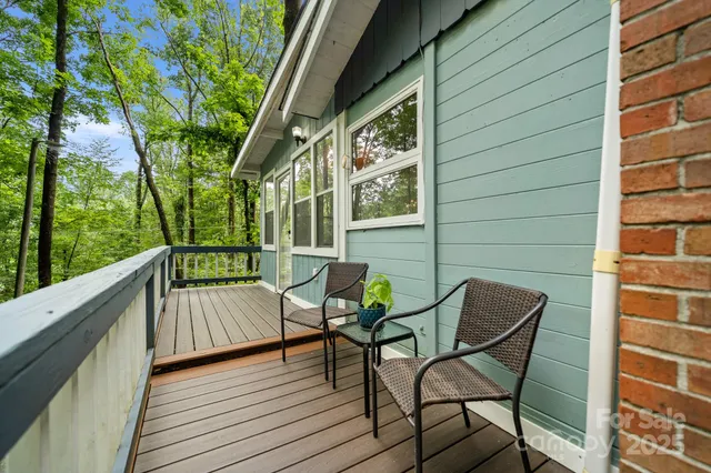 a view of a chair and table in the balcony