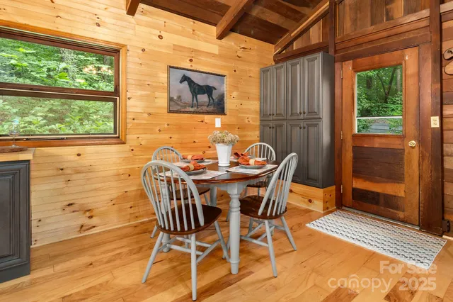 a dining room with furniture and window