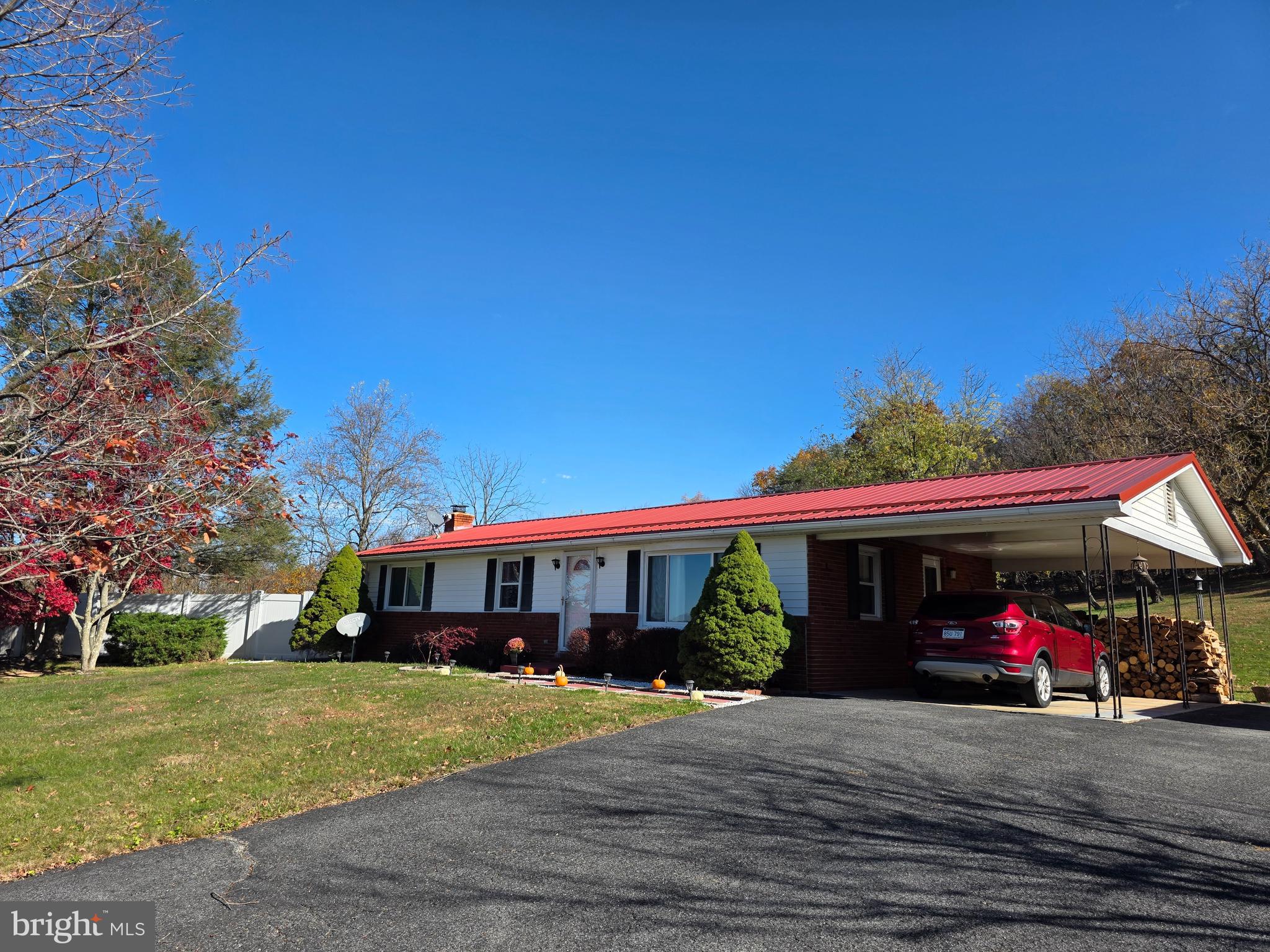 951 Johnsons Mill Road Berkeley Springs, WV 25411 - Photo 1 of 66 a view of a car parked in front of a house
