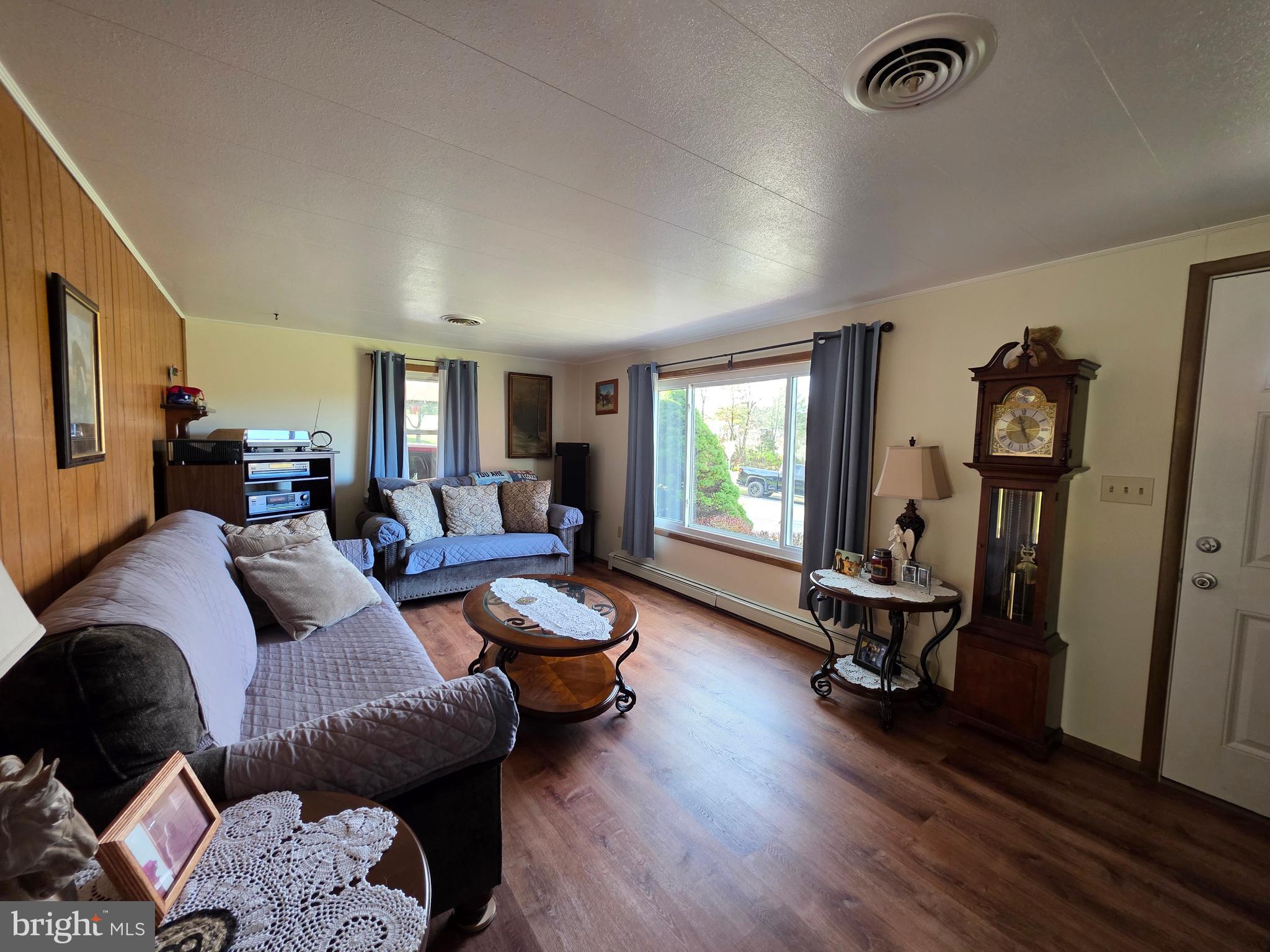 951 Johnsons Mill Road Berkeley Springs, WV 25411 - Photo 13 of 66 a living room with furniture or window and a wooden floor