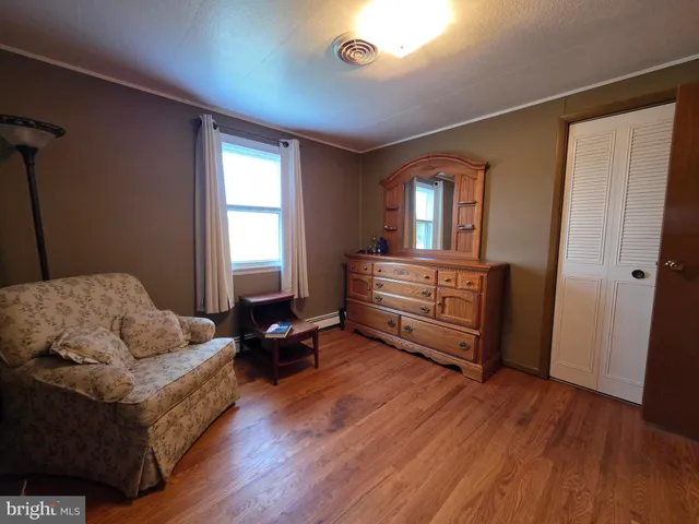 a bathroom with double vanity and a mirror