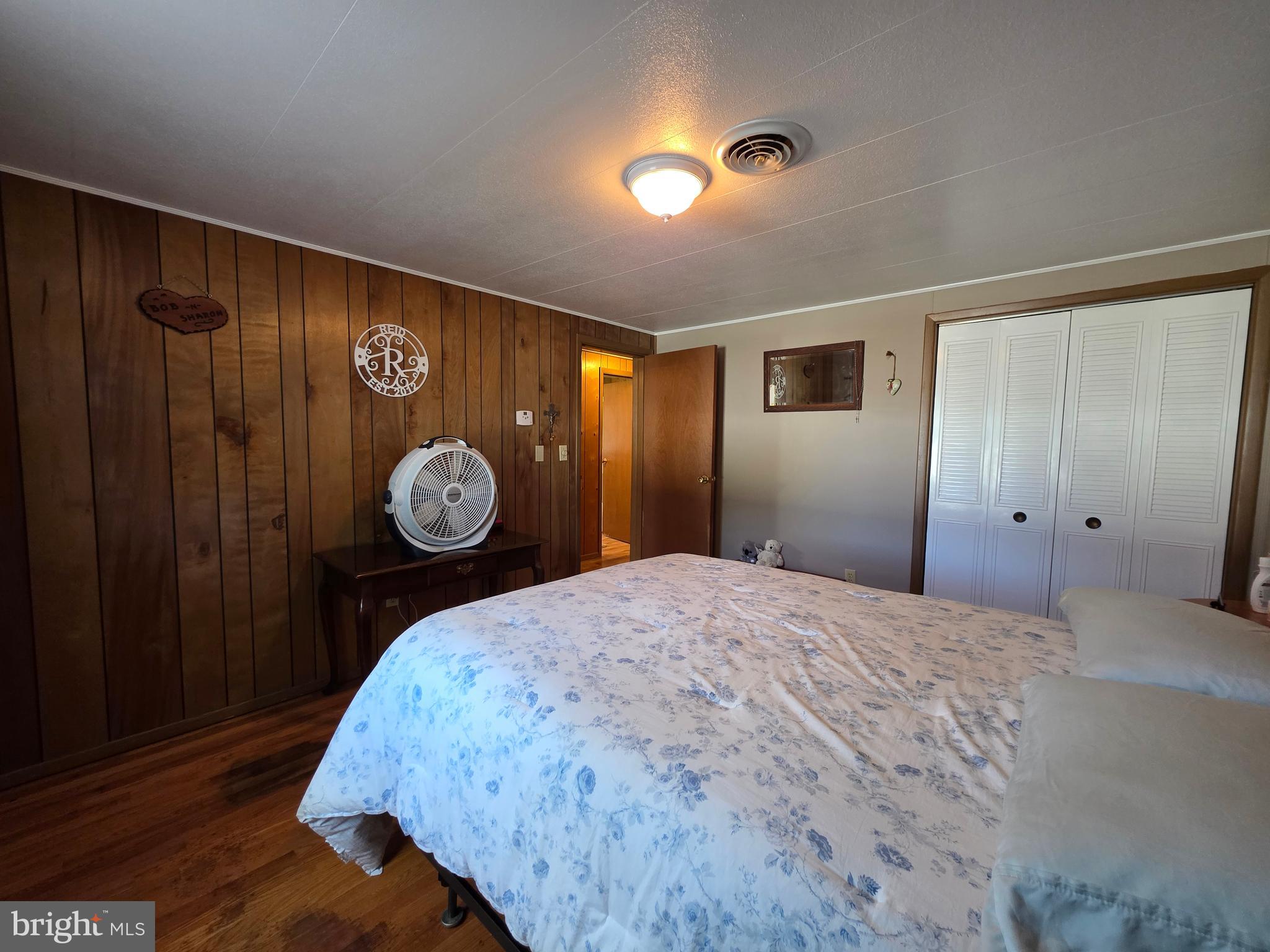 951 Johnsons Mill Road Berkeley Springs, WV 25411 - Photo 28 of 66 a bedroom with a bed and a closet