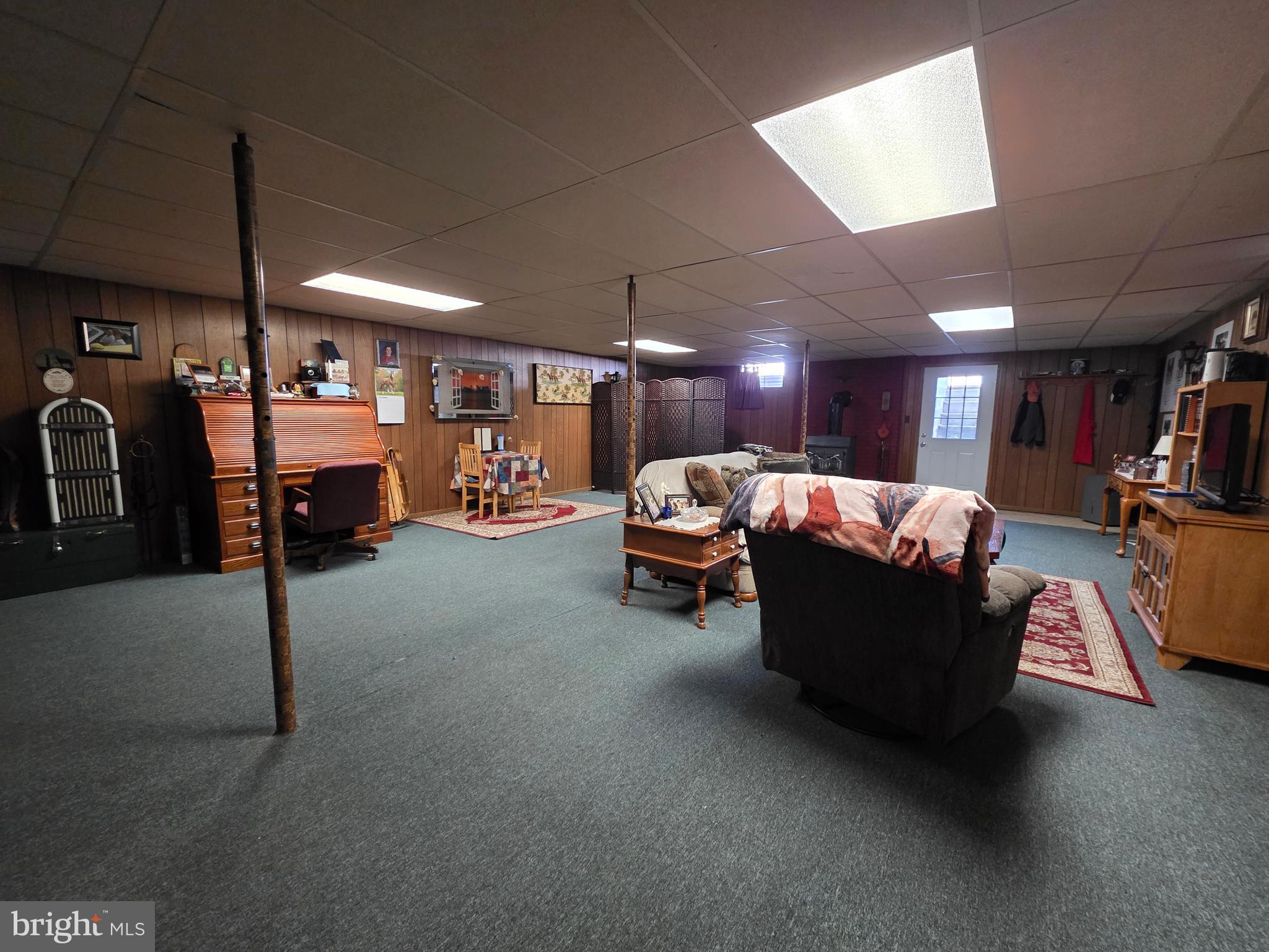 951 Johnsons Mill Road Berkeley Springs, WV 25411 - Photo 35 of 66 a living room with furniture and a flat screen tv