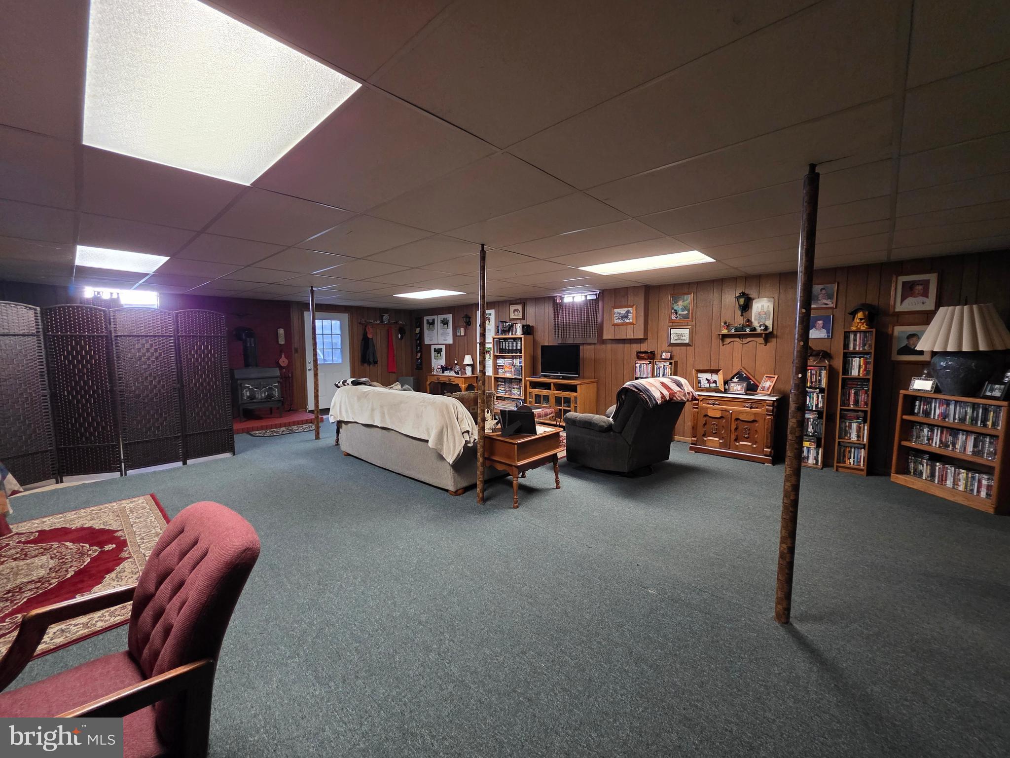 951 Johnsons Mill Road Berkeley Springs, WV 25411 - Photo 38 of 66 a living room with furniture and a flat screen tv