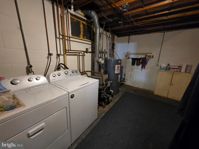 a white house covered with tall trees