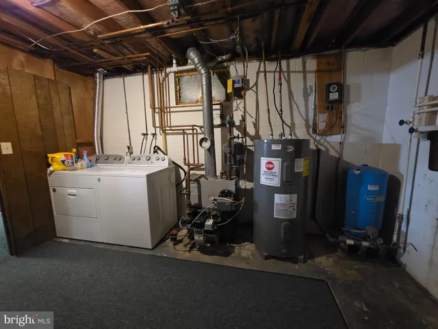 a car parked in front of a house with a yard