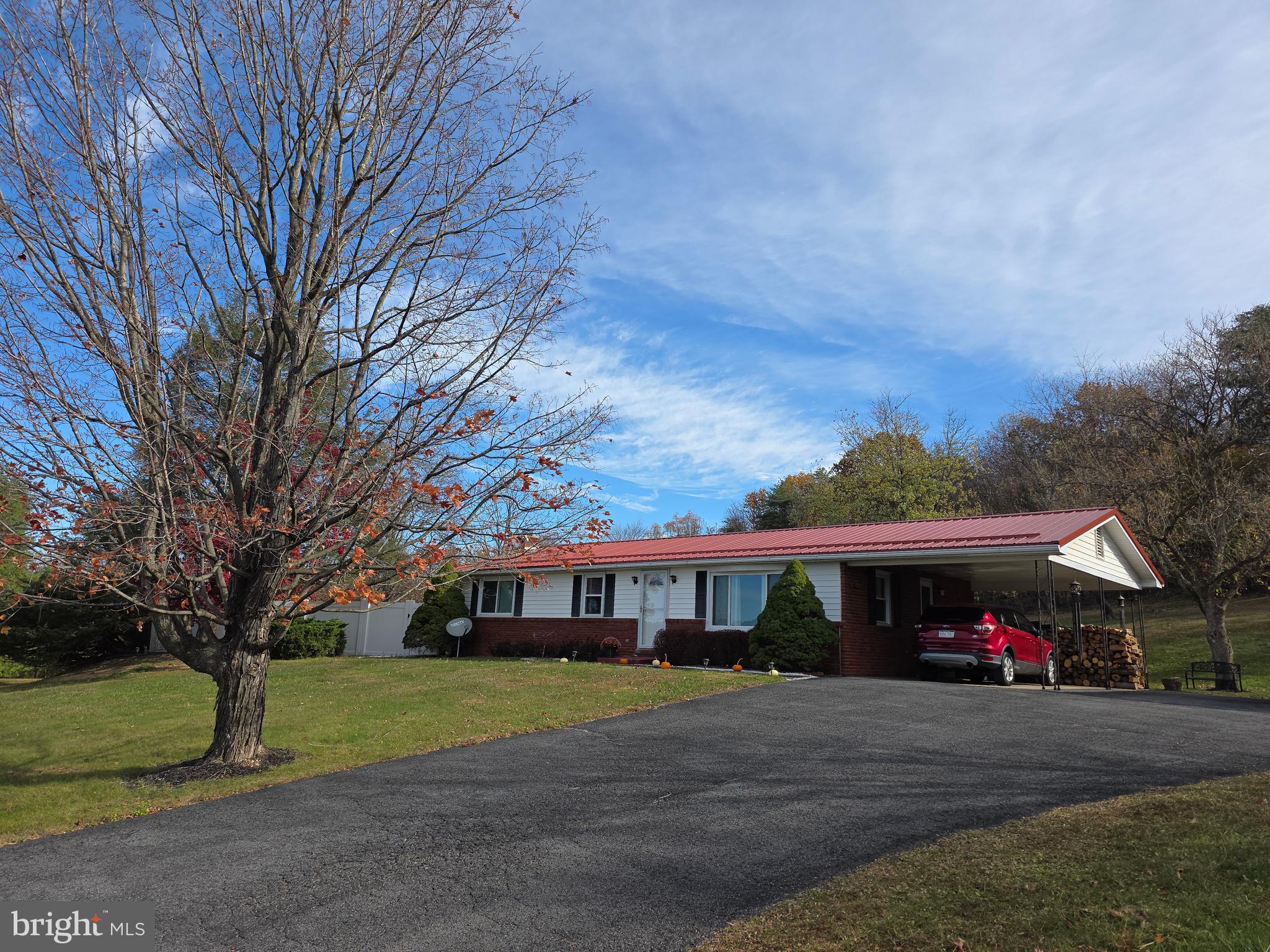 951 Johnsons Mill Road Berkeley Springs, WV 25411 - Photo 46 of 66 a front view of house with yard and green space