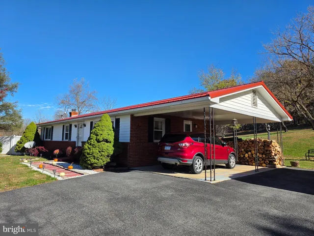 a view of outdoor space with garden and trees