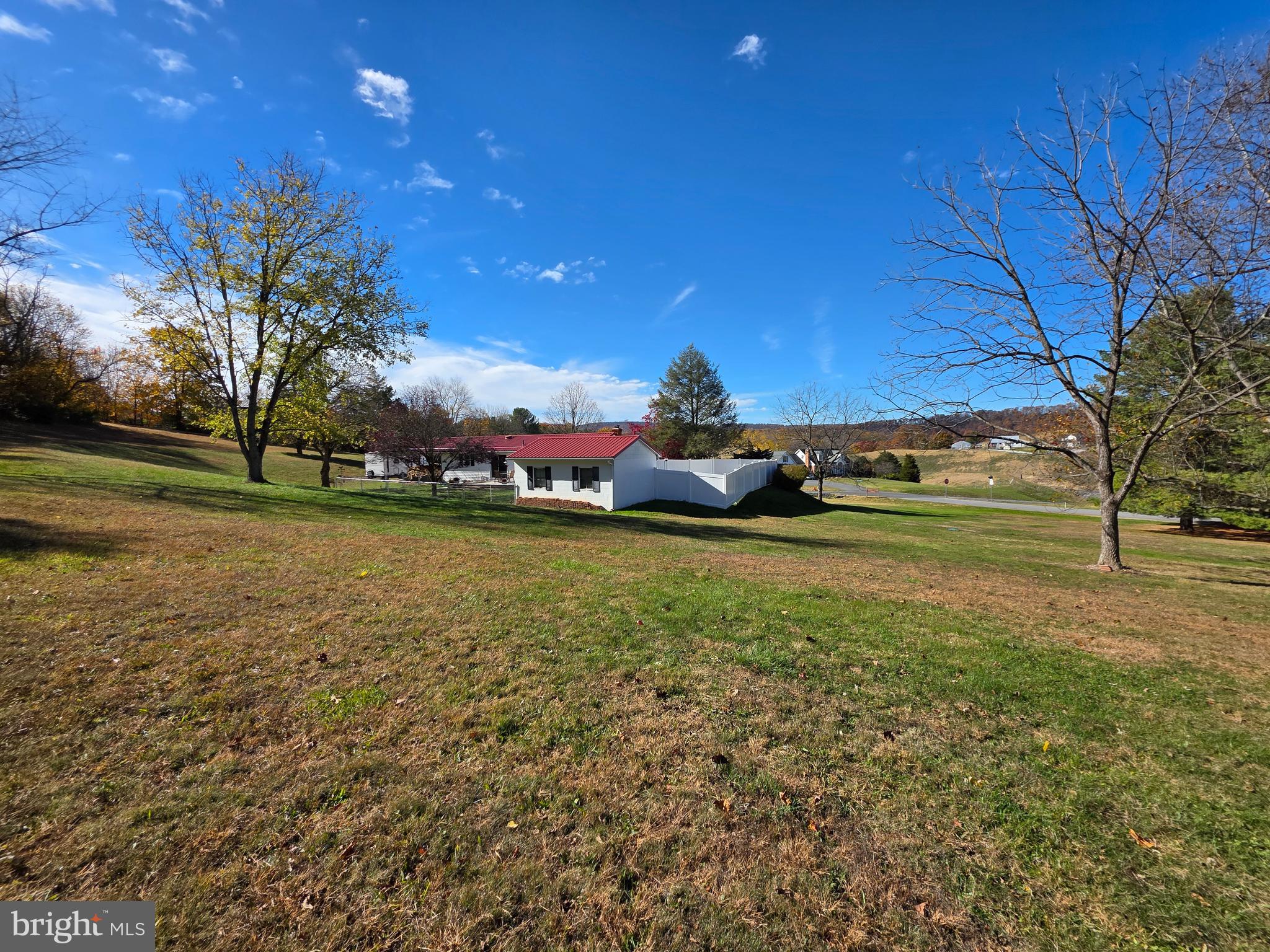 951 Johnsons Mill Road Berkeley Springs, WV 25411 - Photo 60 of 66 a view of a field with large trees