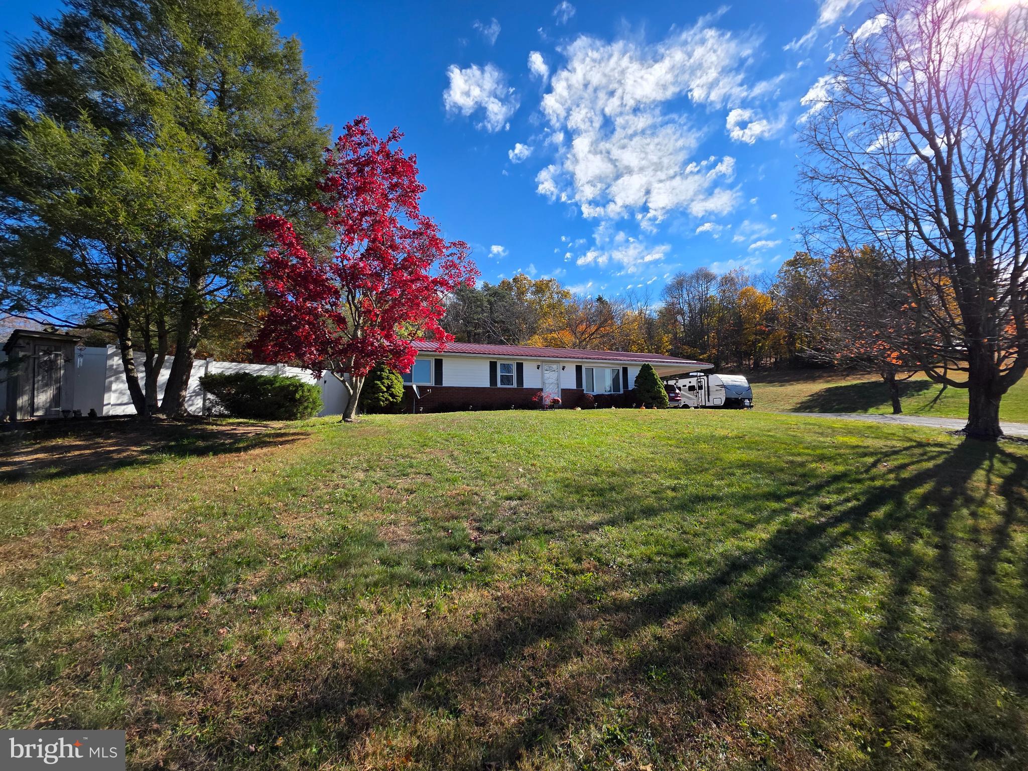 951 Johnsons Mill Road Berkeley Springs, WV 25411 - Photo 65 of 66 a view of a house with a yard