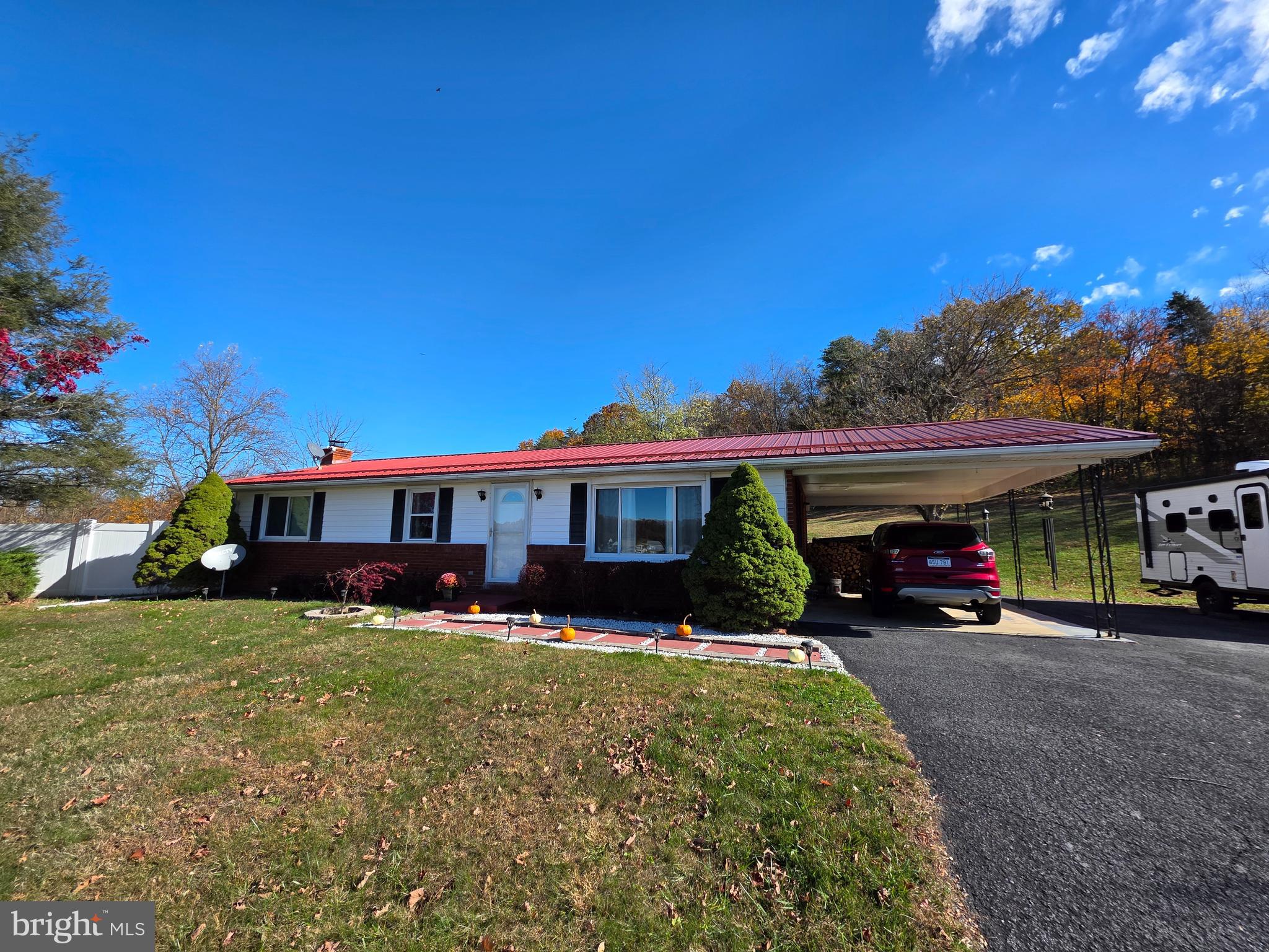 951 Johnsons Mill Road Berkeley Springs, WV 25411 - Photo 66 of 66 a view of a house with a yard and sitting area