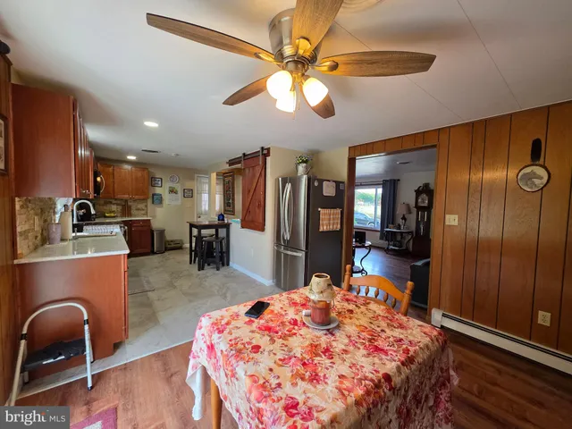 a view of a livingroom with furniture window and wooden floor
