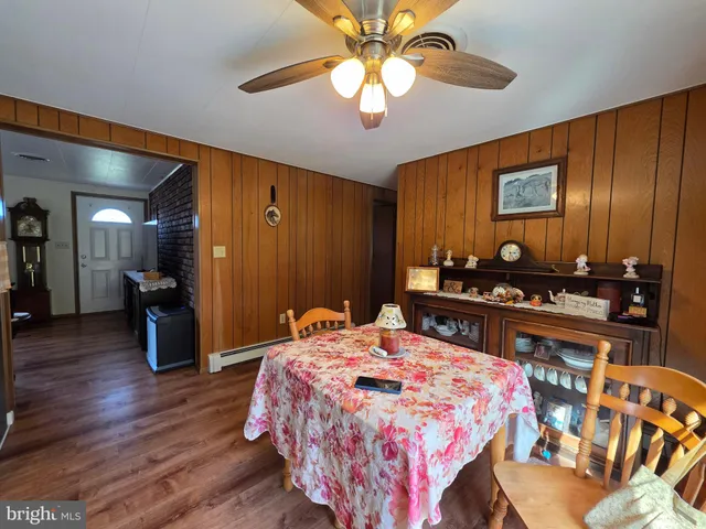 a living room with furniture or window and a wooden floor
